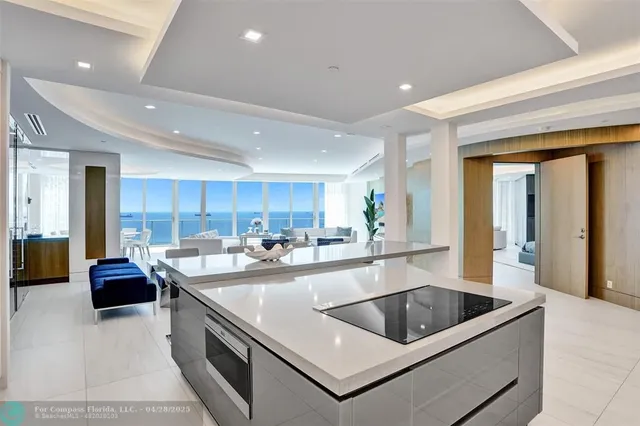 a spacious bathroom with a double vanity sink a large mirror and shower