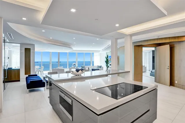 a spacious bathroom with a double vanity sink a large mirror and shower