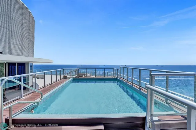 a living room with fireplace furniture and a flat screen tv