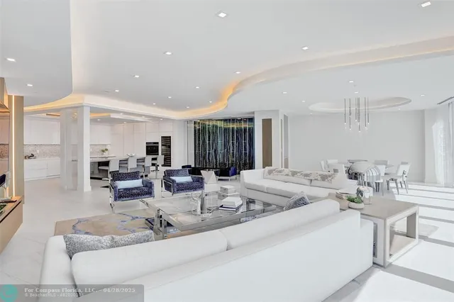 a view of a dining room with furniture large windows and wooden floor