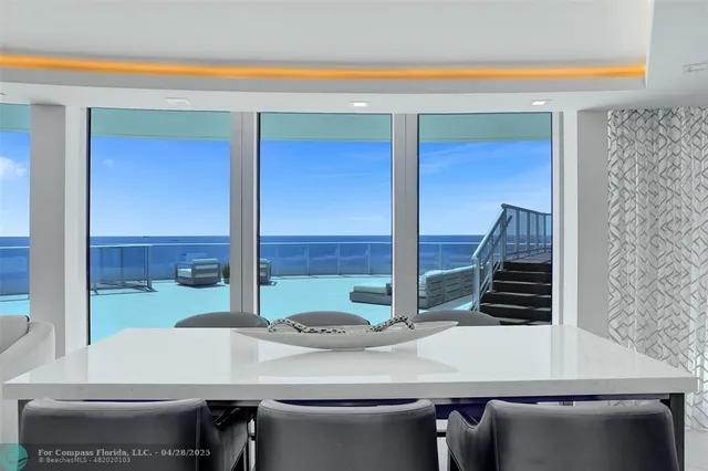 a living room with furniture fireplace and flat screen tv