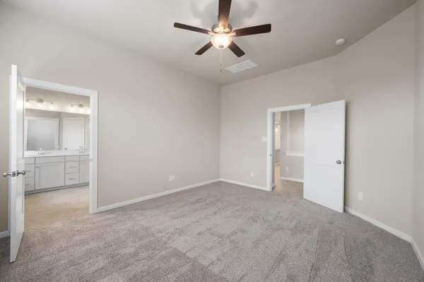 a spacious bathroom with a double vanity sink a mirror and a bathtub
