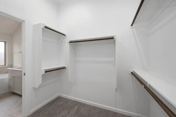 a view of a hallway with washer and dryer