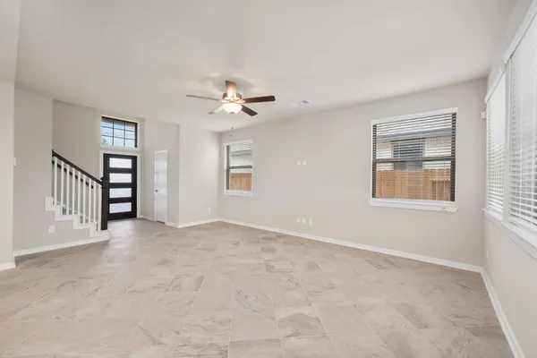 a kitchen with stainless steel appliances granite countertop a refrigerator a stove a sink and a microwave