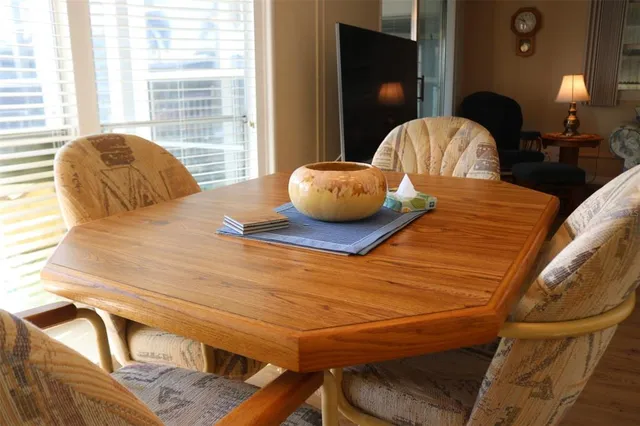a living room with furniture a lamp and a window
