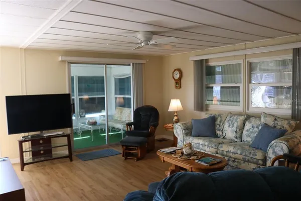 a living room with furniture and a lamp
