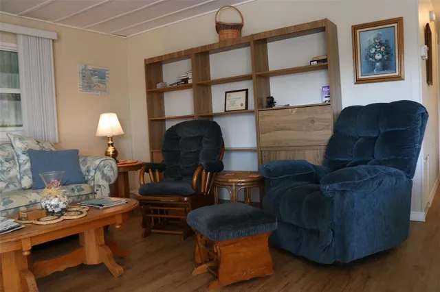 a bedroom with a bed and flat screen tv