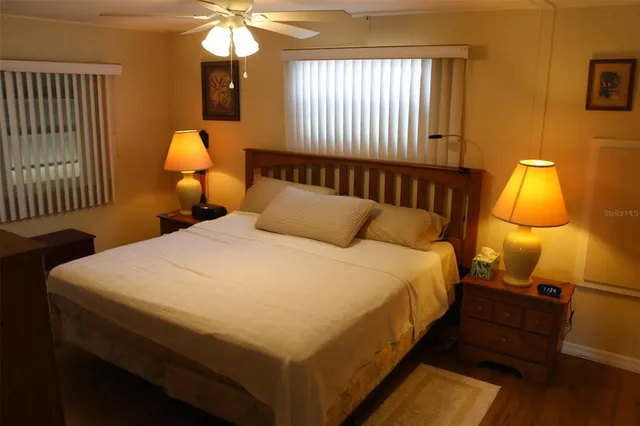 a bedroom with a bed and window