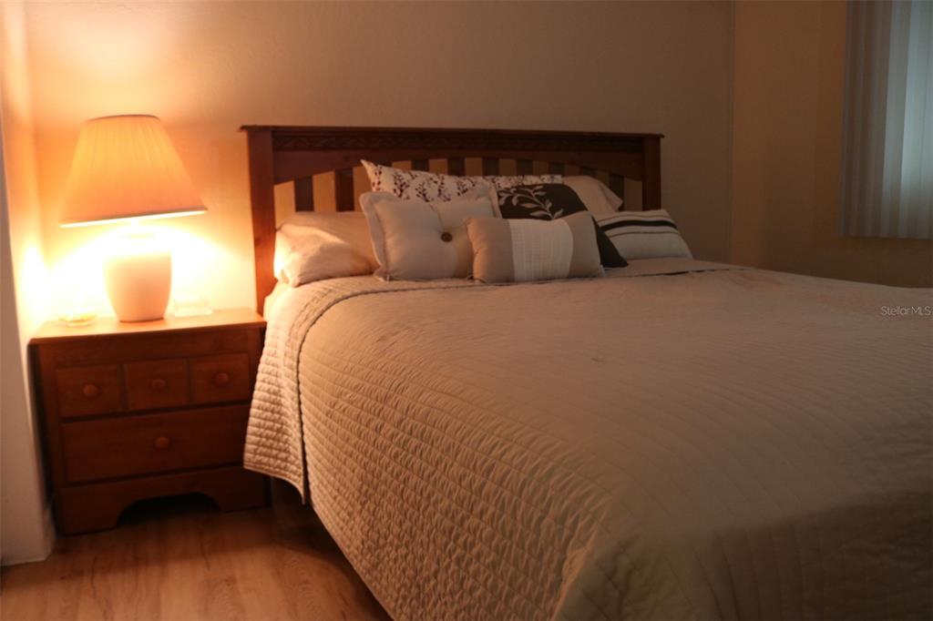 316 Estrada Street North Port, FL 34287 - Photo 27 of 59 a bed sitting in a bedroom next to a window