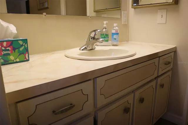 a view of an chairs and table in kitchen