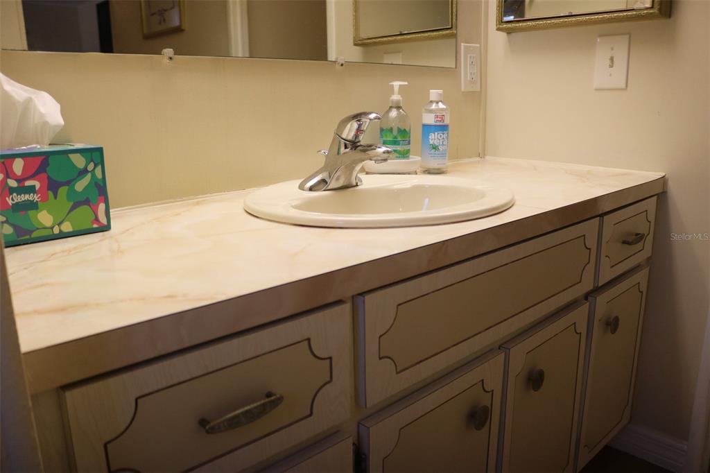 316 Estrada Street North Port, FL 34287 - Photo 31 of 59 a bathroom with a sink and a mirror