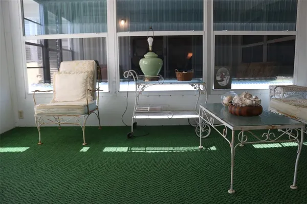 a view of a house with a small yard and plants