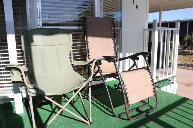 a view of a porch with seating space