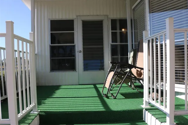 a view of a door and chair in a room