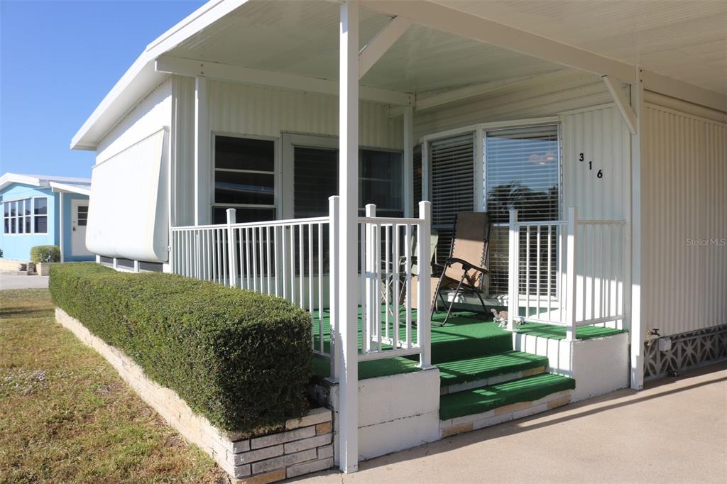 316 Estrada Street North Port, FL 34287 - Photo 38 of 59 a view of a house with a small yard and plants