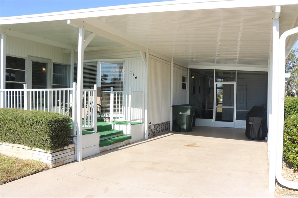 316 Estrada Street North Port, FL 34287 - Photo 39 of 59 a view of a house with a porch