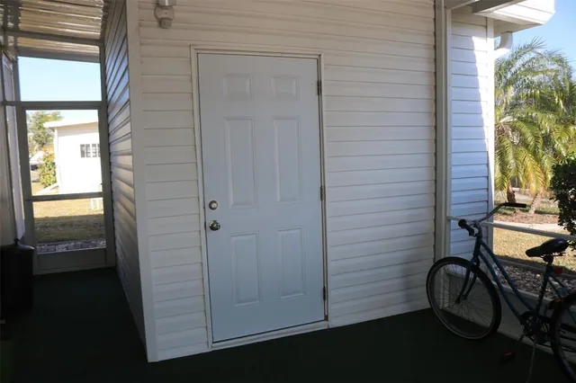 a view of a swimming pool and lounge chairs