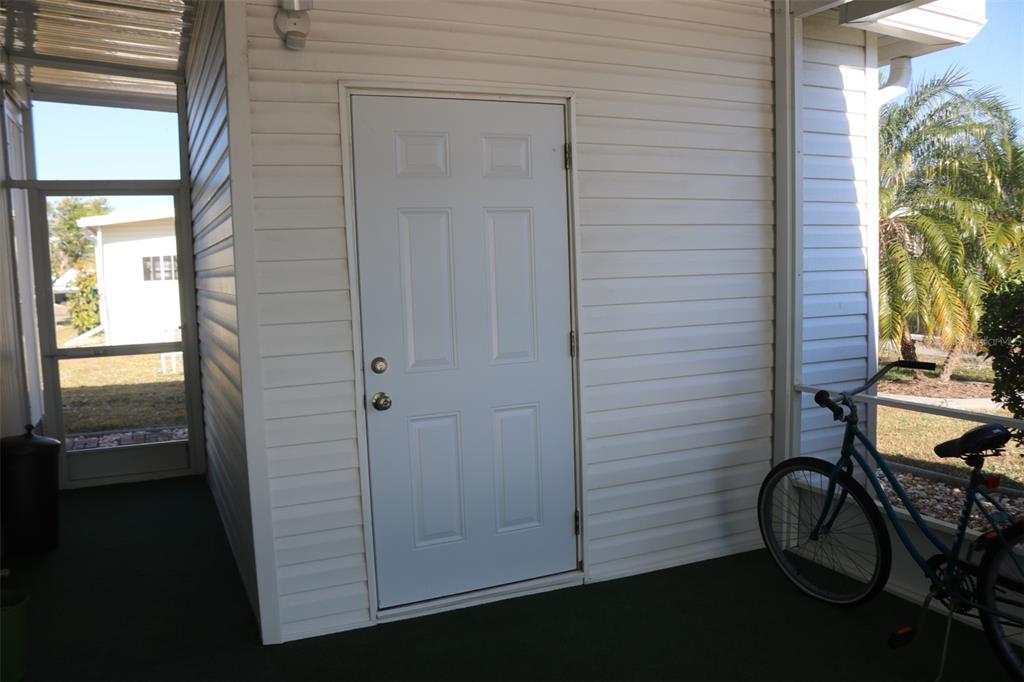 316 Estrada Street North Port, FL 34287 - Photo 41 of 59 a view of a door and chair in a room