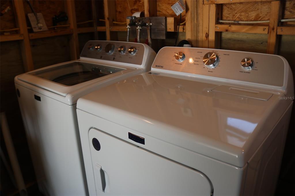 316 Estrada Street North Port, FL 34287 - Photo 43 of 59 a utility room with dryer and washer