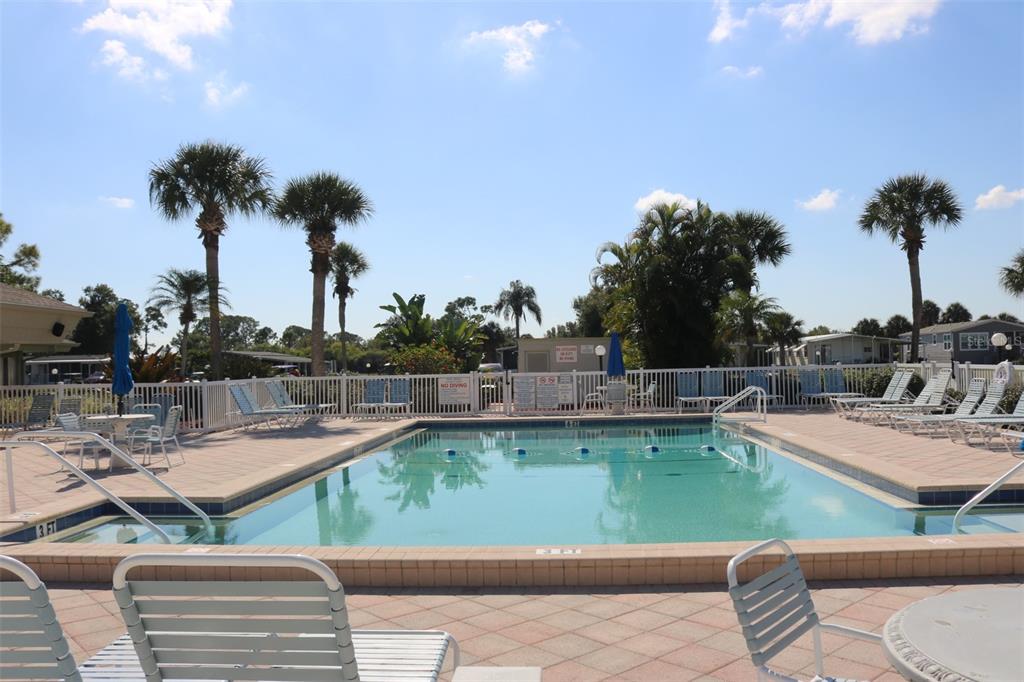 316 Estrada Street North Port, FL 34287 - Photo 45 of 59 a view of a swimming pool with lounge chairs