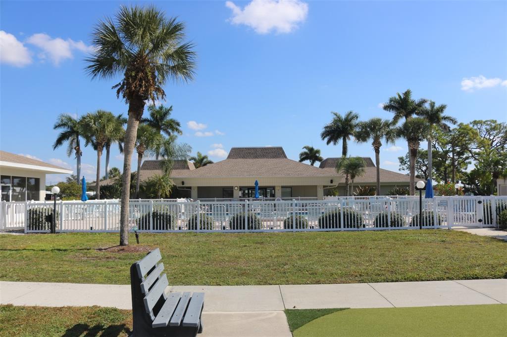 316 Estrada Street North Port, FL 34287 - Photo 52 of 59 a front view of a house with garden and patio