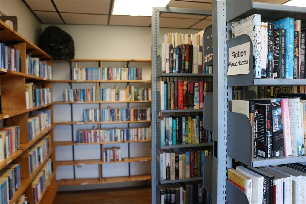 316 Estrada Street North Port, FL 34287 - Photo 56 of 59 a view of a living room that has a book shelf and a book shelf