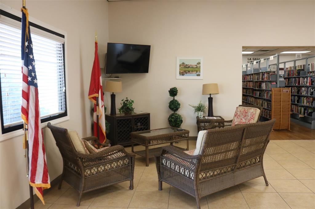 316 Estrada Street North Port, FL 34287 - Photo 58 of 59 a living room with furniture and a flat screen tv