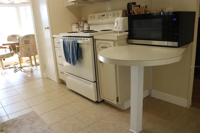 a kitchen with stainless steel appliances a refrigerator and a stove