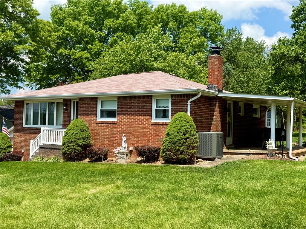 151 Huntingdon Road Wyano, PA 15695 - Photo 16 of 36 a front view of a house with a garden