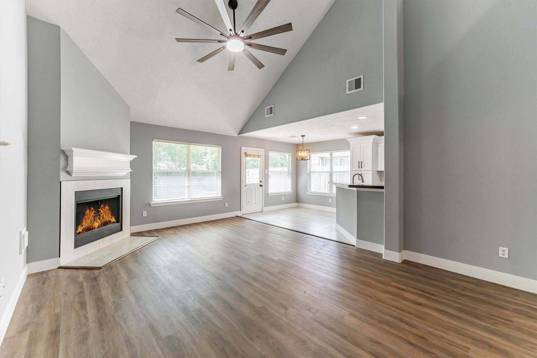 3227 Candlepine Drive Spring, TX 77388 - Photo 2 of 21 Living Room has tall ceilings with updated ceiling fan and beautiful new flooring.
