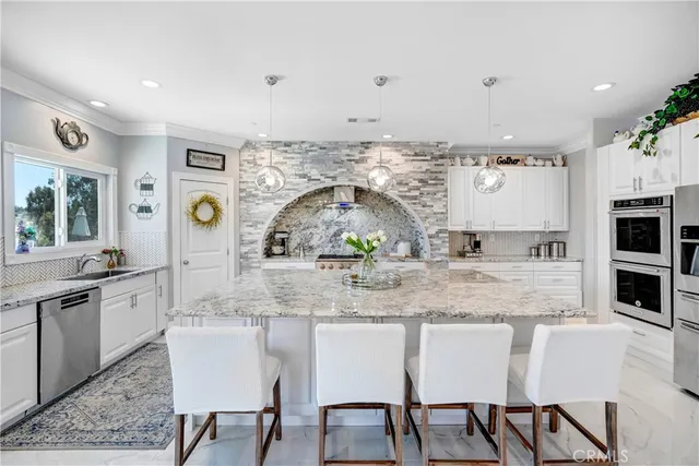 an aerial view of a residential houses with city view