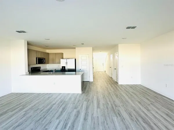 a view of kitchen with wooden floor