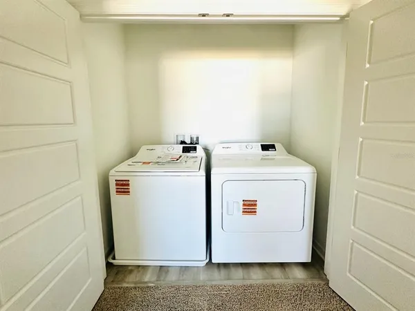 a utility room with dryer and washer