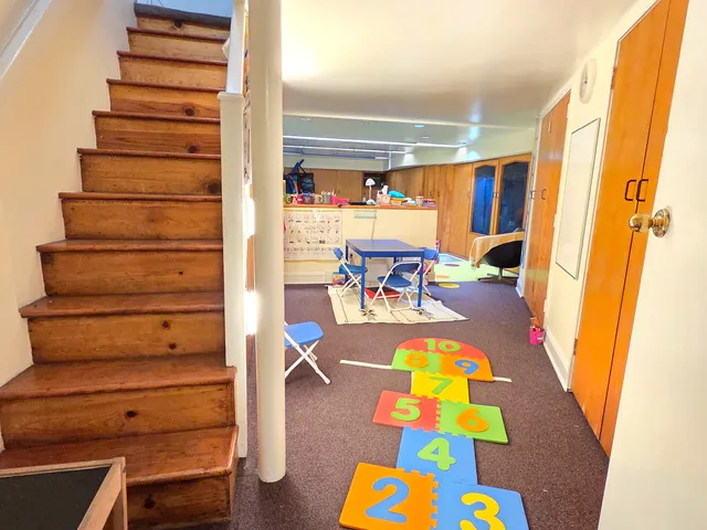 a view of living room with furniture and rug