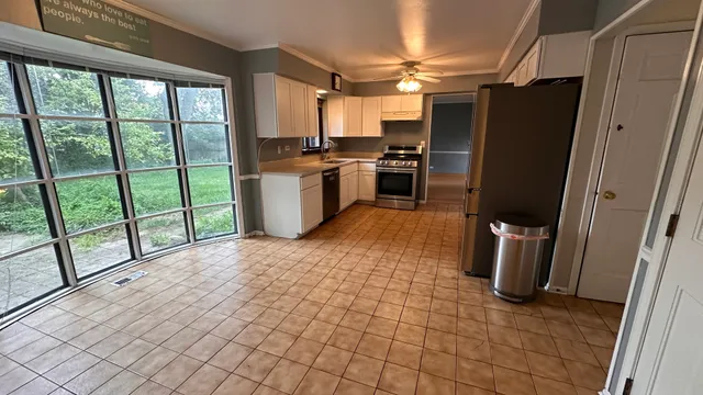 a kitchen with stainless steel appliances a refrigerator and a sink