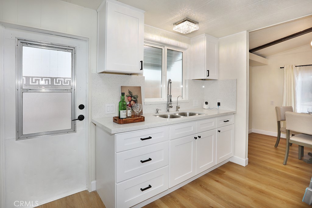 17261 Gothard Street, Unit 60 Huntington Beach, CA 92647 - Photo 18 of 27 a bathroom with double vanity sink and mirror