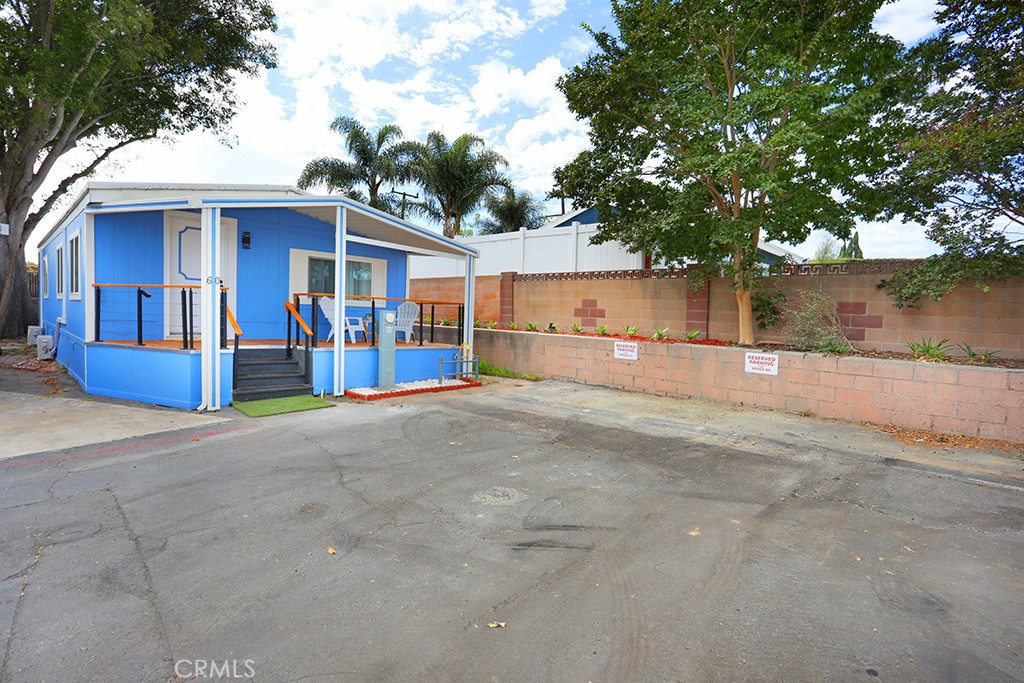 17261 Gothard Street, Unit 60 Huntington Beach, CA 92647 - Photo 24 of 27 front view of a house with a street