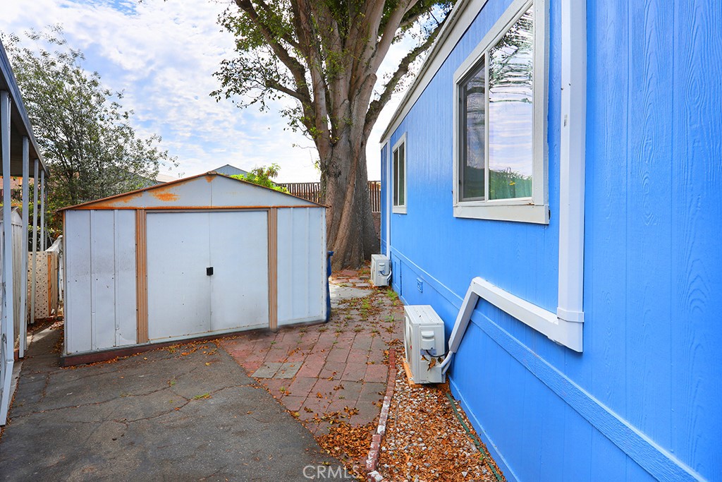 17261 Gothard Street, Unit 60 Huntington Beach, CA 92647 - Photo 26 of 27 a view of a house with a small yard