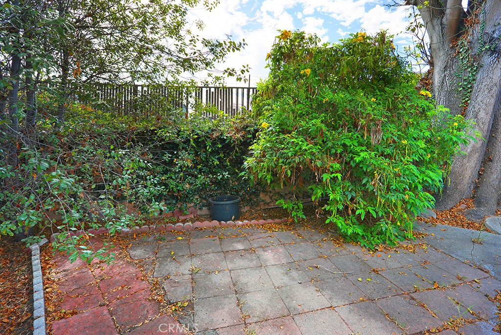 17261 Gothard Street, Unit 60 Huntington Beach, CA 92647 - Photo 27 of 27 a view of a pathway both side of house