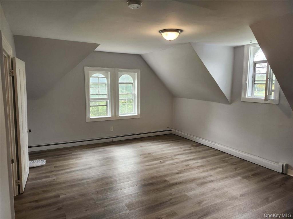 165 South Cross Road, Unit 3 Staatsburg, NY 12580 - Photo 3 of 15 an empty room with wooden floor and windows