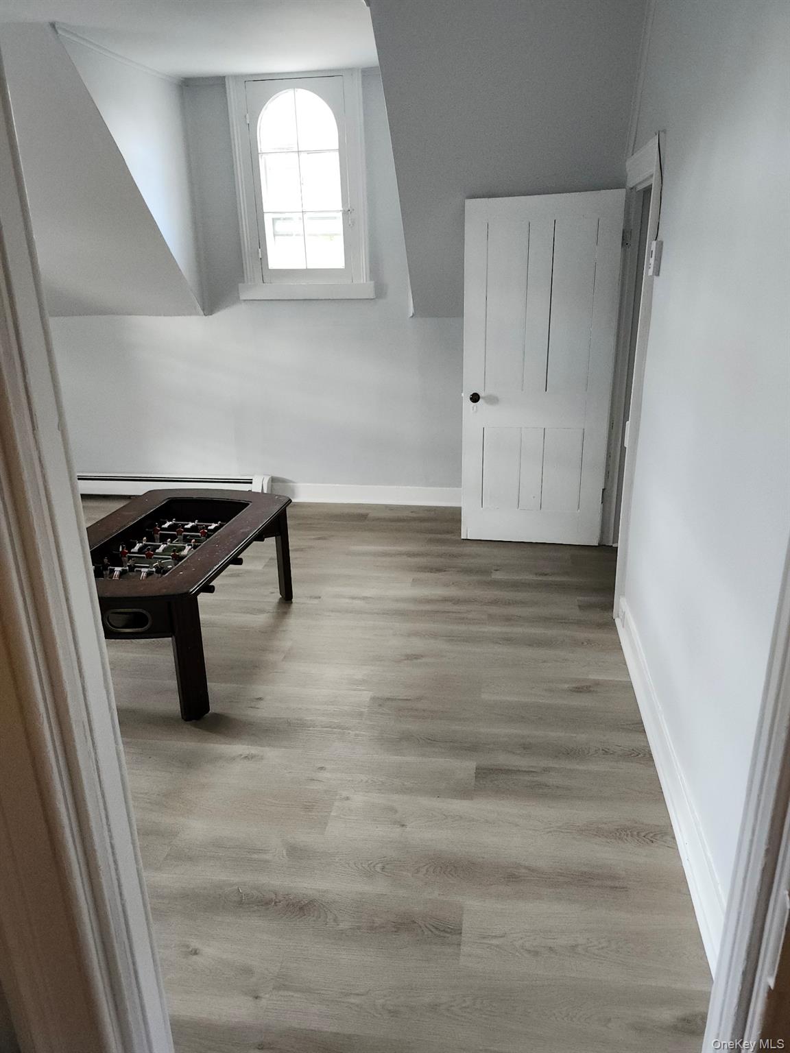 165 South Cross Road, Unit 3 Staatsburg, NY 12580 - Photo 5 of 15 a room with wooden floor and white walls