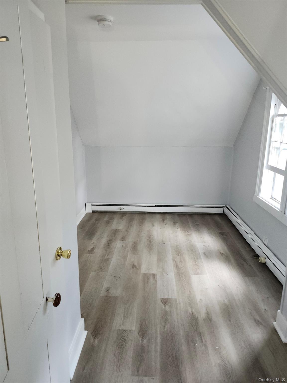 165 South Cross Road, Unit 3 Staatsburg, NY 12580 - Photo 10 of 15 a view of a small space with wooden floor and a window