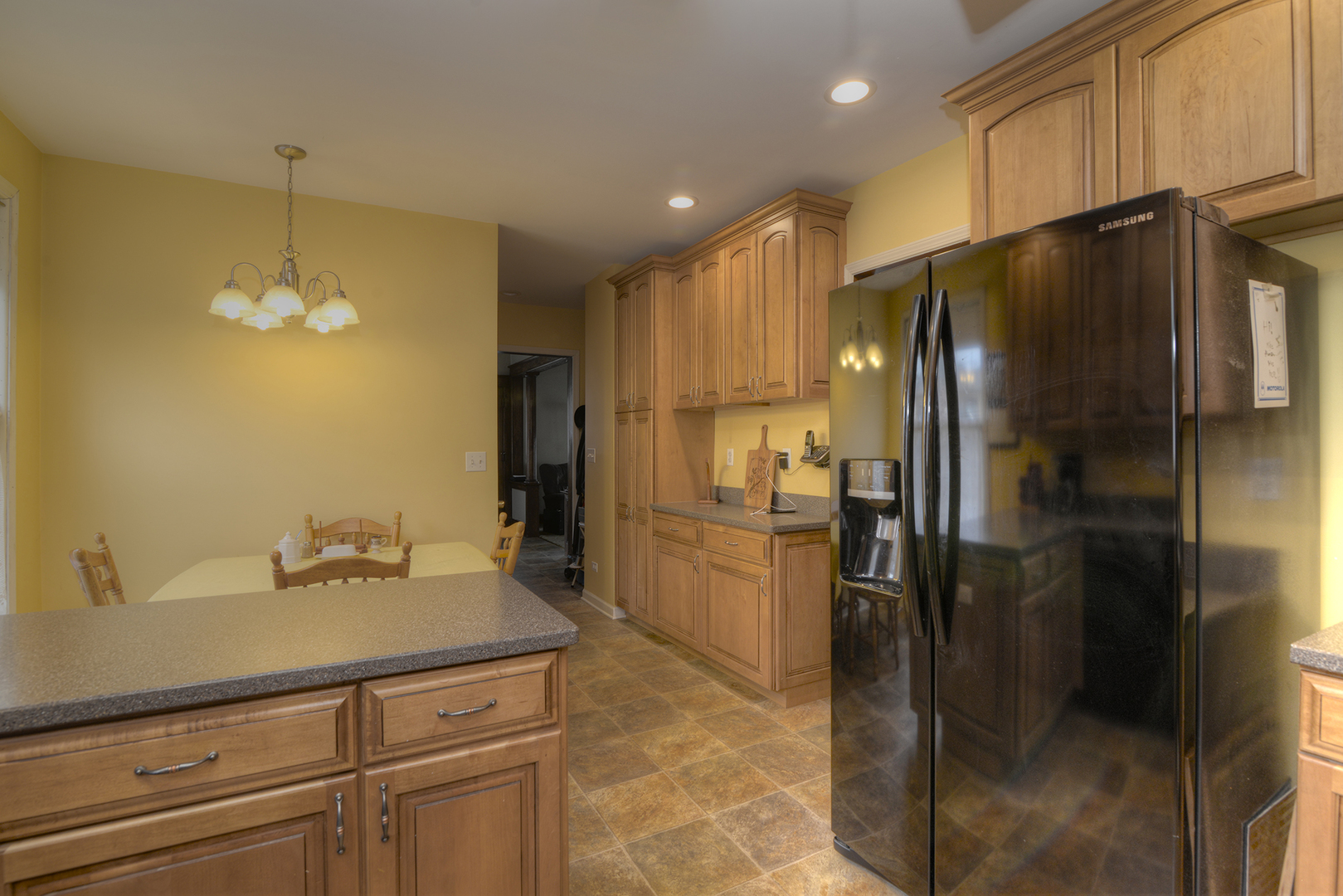 564 North Spring Street Elgin, IL 60120 - Photo 11 of 27 a kitchen with a refrigerator and countertop