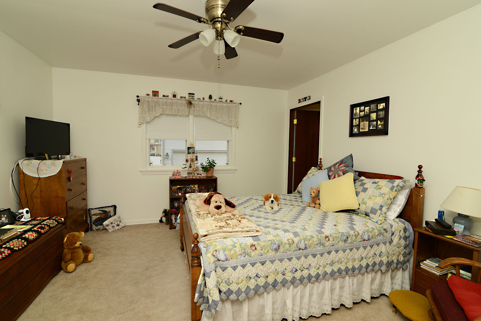 564 North Spring Street Elgin, IL 60120 - Photo 12 of 27 a bedroom with a bed and wooden floor