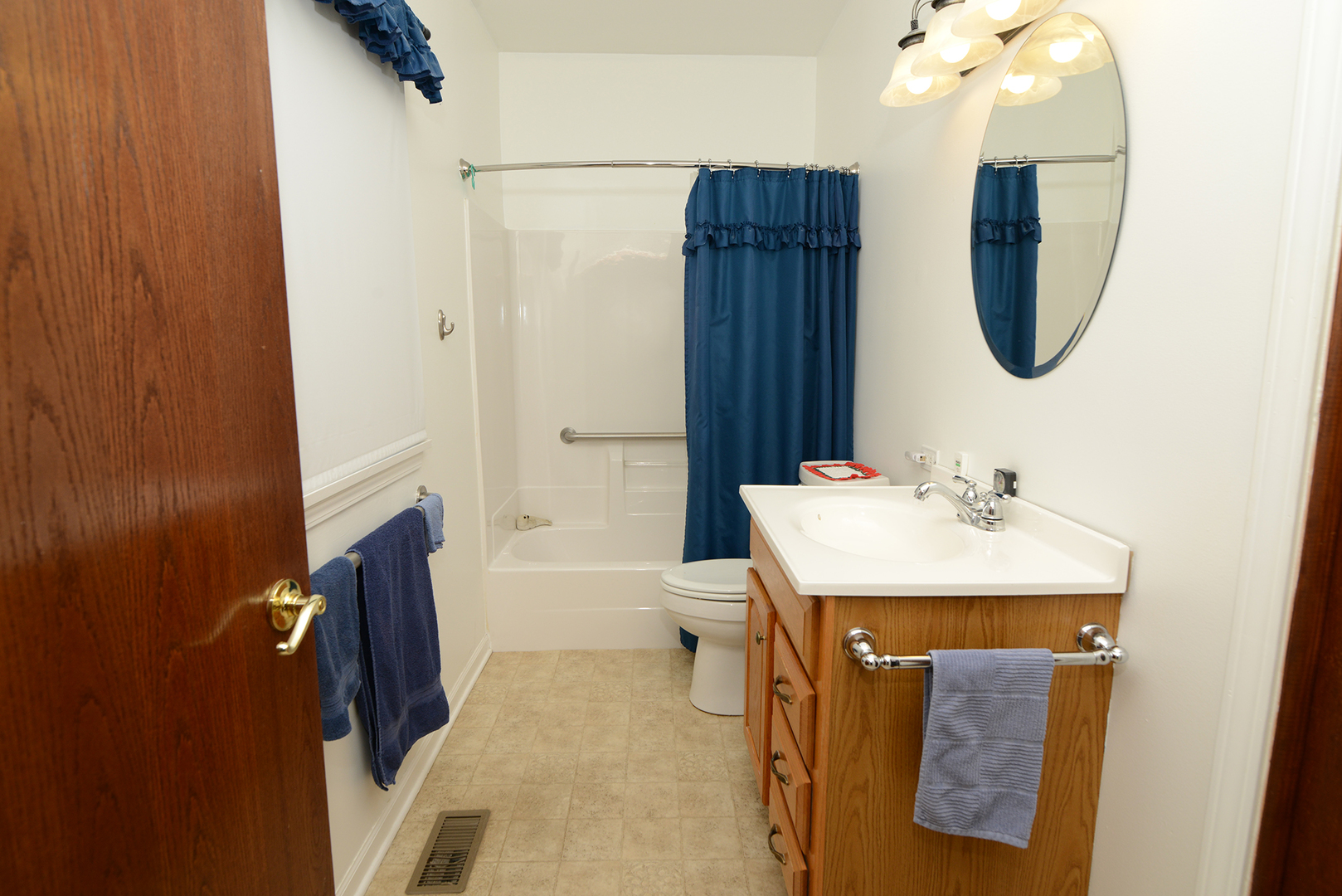564 North Spring Street Elgin, IL 60120 - Photo 13 of 27 a bathroom with a sink toilet and shower