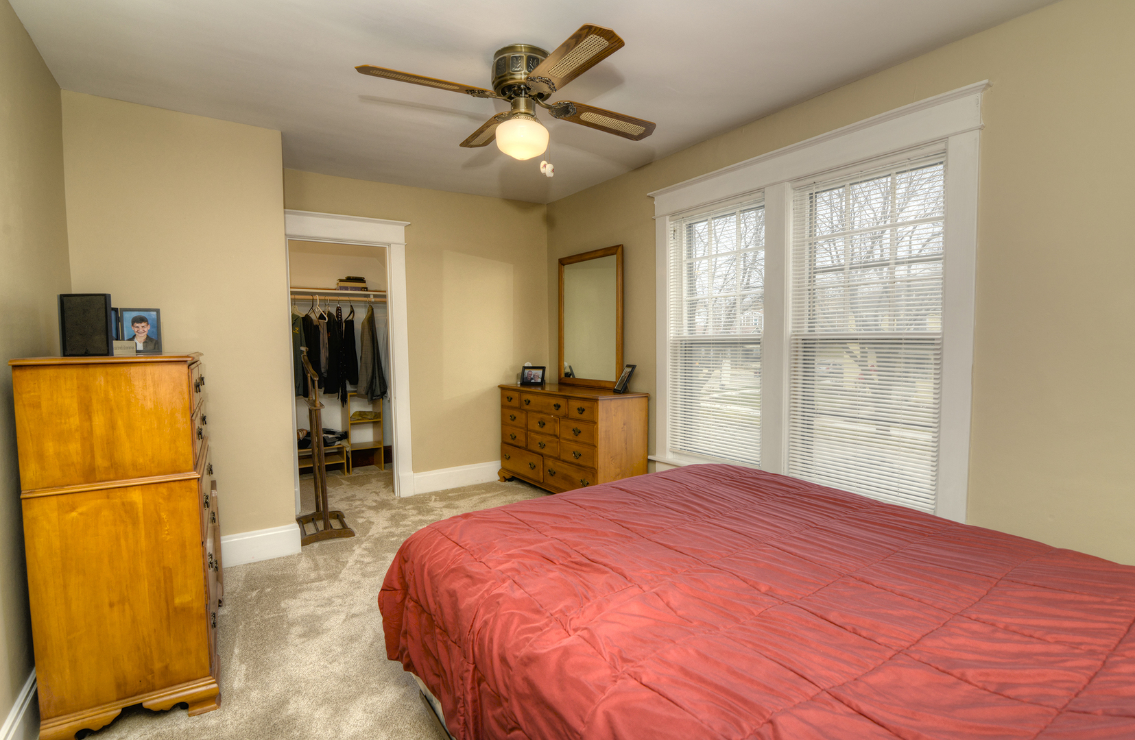 564 North Spring Street Elgin, IL 60120 - Photo 14 of 27 a bedroom with a bed and a large mirror on the dresser
