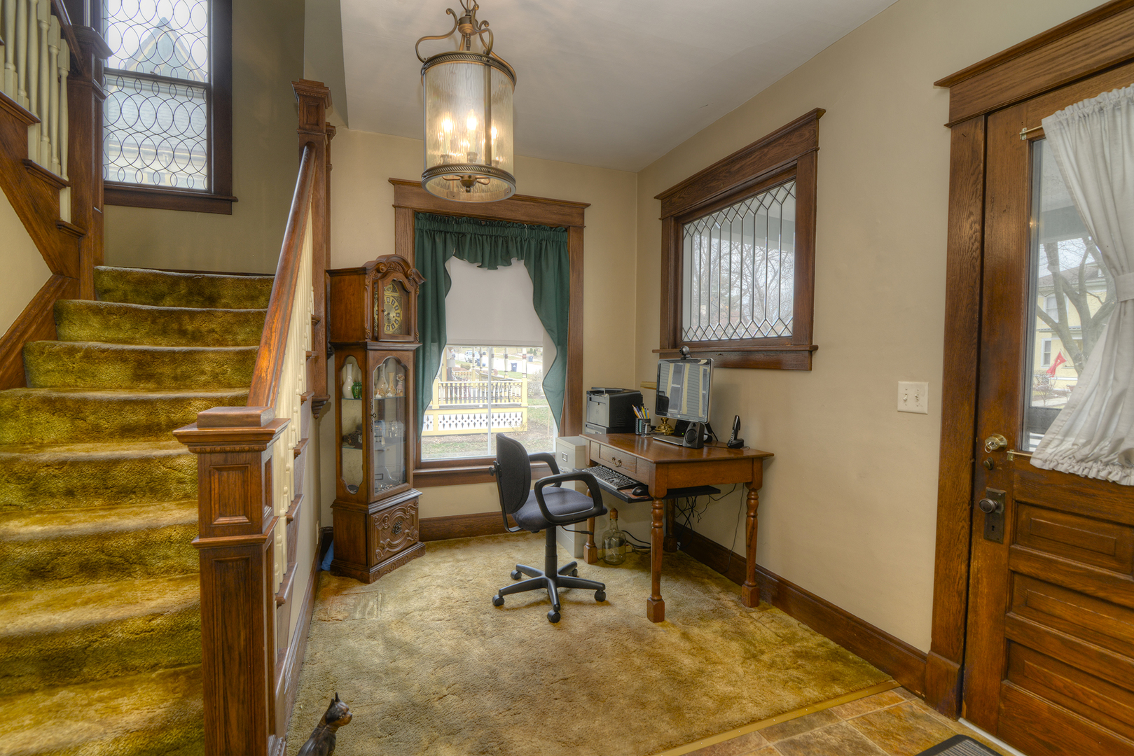564 North Spring Street Elgin, IL 60120 - Photo 4 of 27 a view of a workspace with furniture and a window