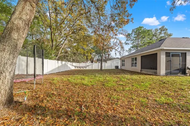 a backyard of a house with lots of green space