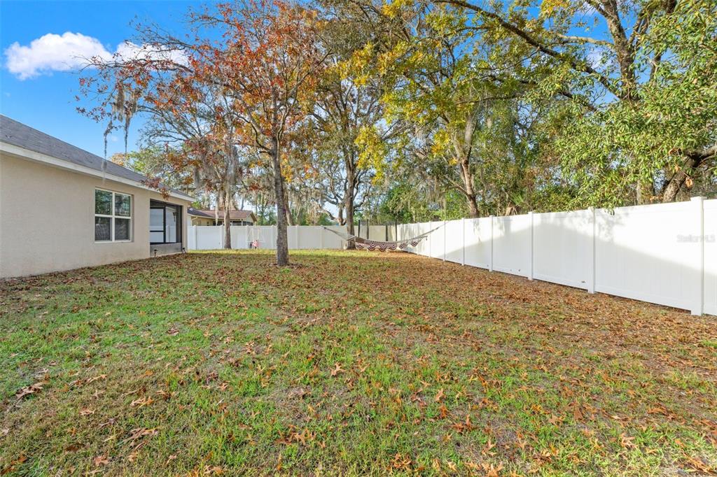 2448 Dothan Avenue Spring Hill, FL 34609 - Photo 19 of 20 a view of empty room with large trees