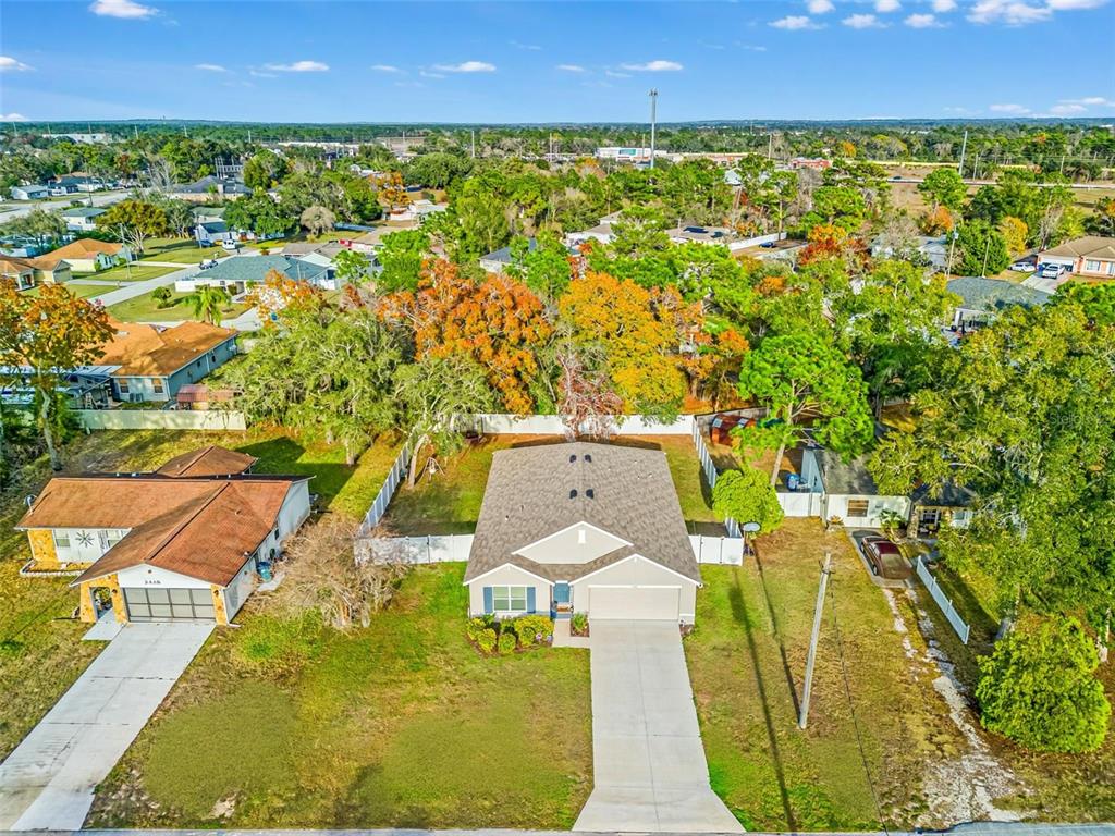 2448 Dothan Avenue Spring Hill, FL 34609 - Photo 2 of 20 an aerial view of residential houses with outdoor space and swimming pool